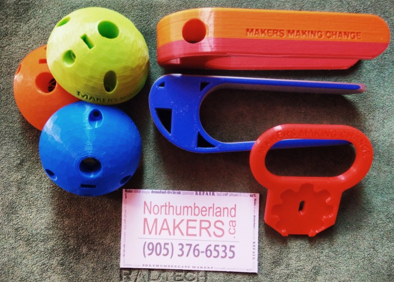 Low tech 3D printed devices in assorted colours.