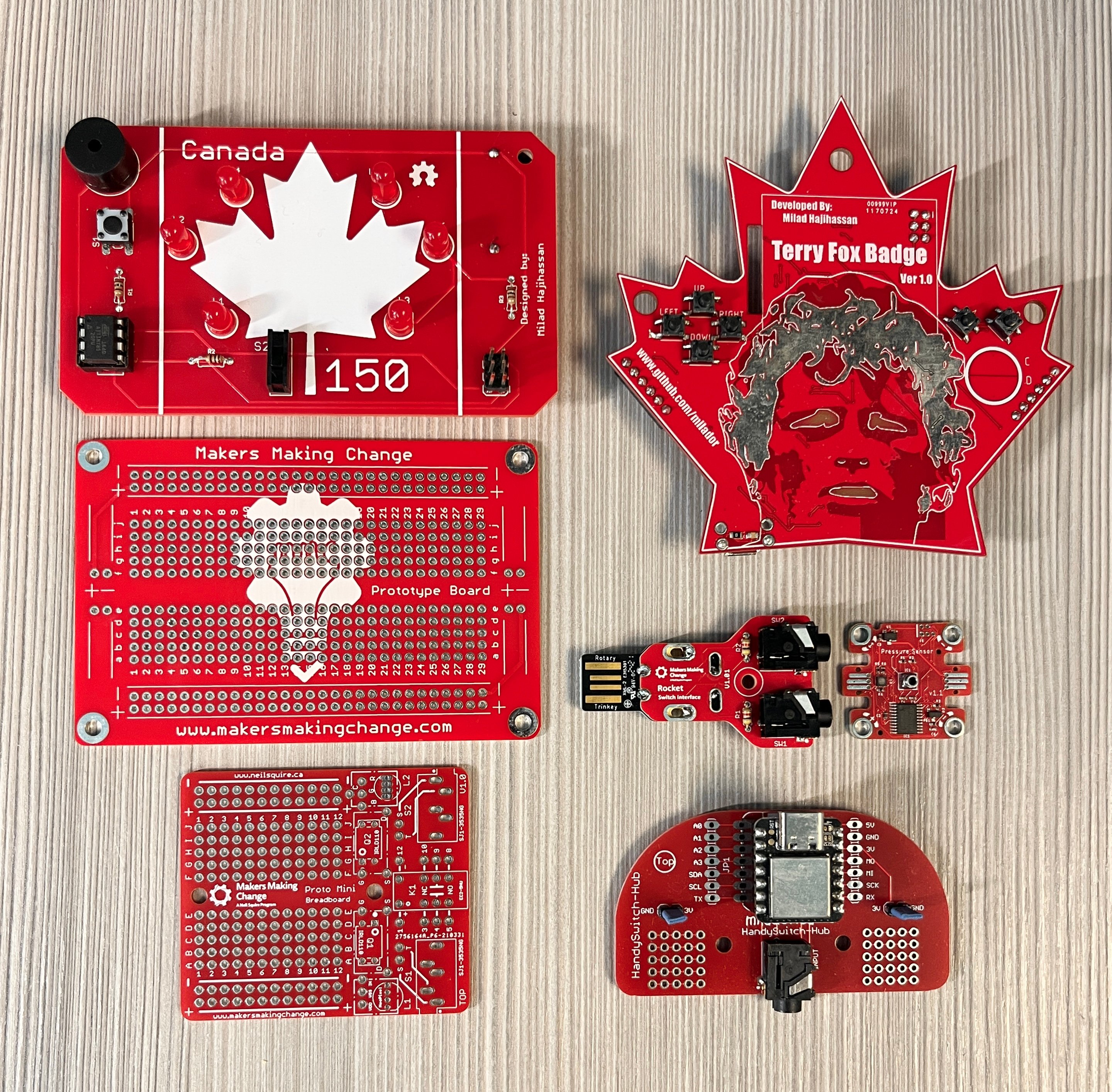 Six circuit boards that Milad designed, including a Maple Leaf badge, A Terry Fox badge, as well as proto boards that are used to test designs and teach soldering skills to students.