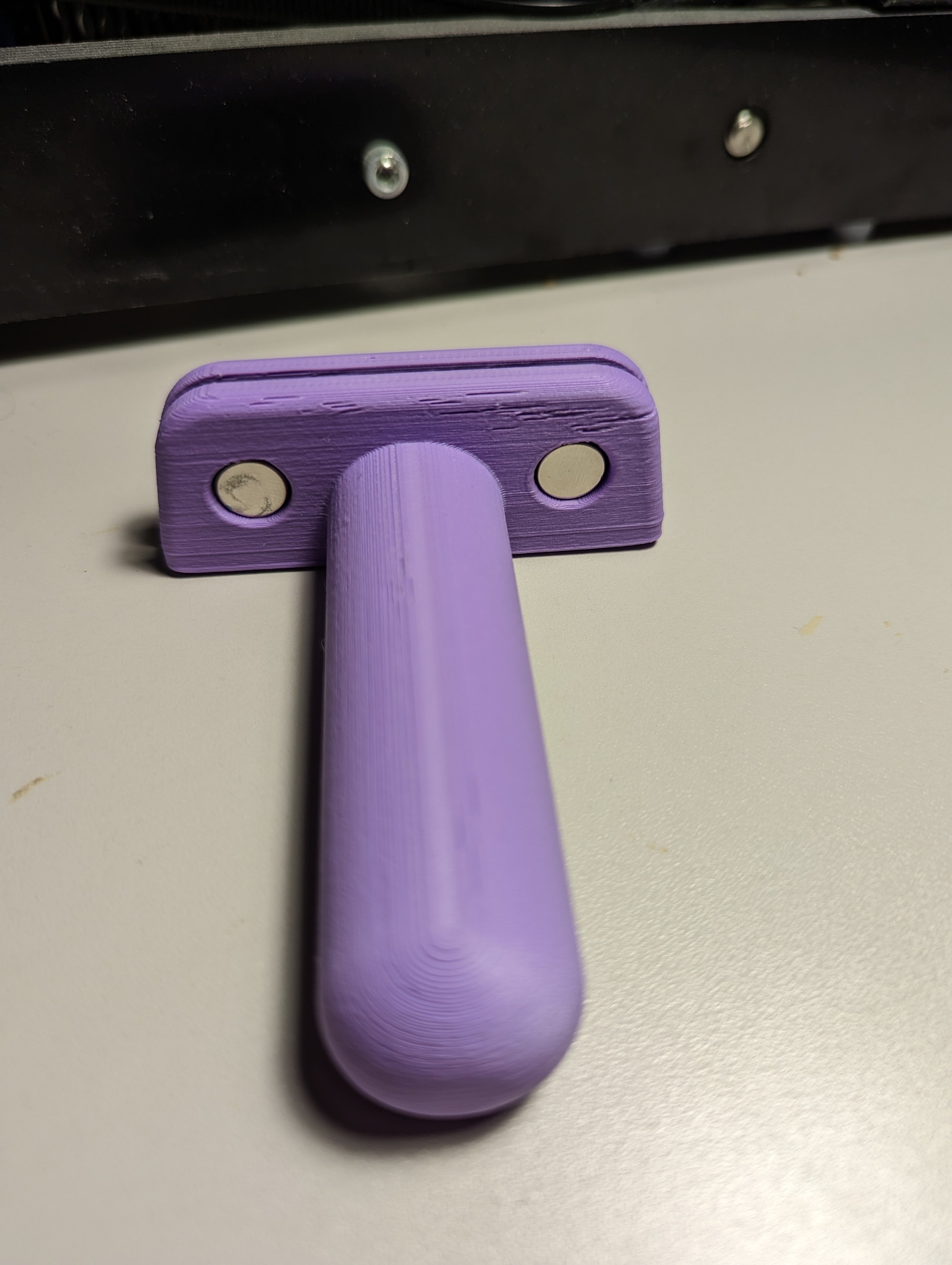 Assembled knife guide arthritis aid sitting on a counter