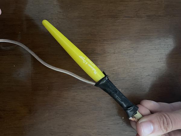 Attaching speaker wire to brush with electrical tape