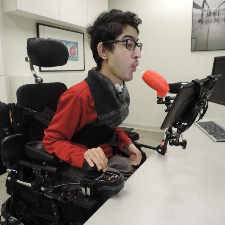 Milad, MMC, using a LipSync device.