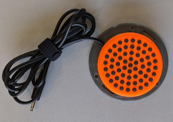 Interact switch, the top is orange with black dots.