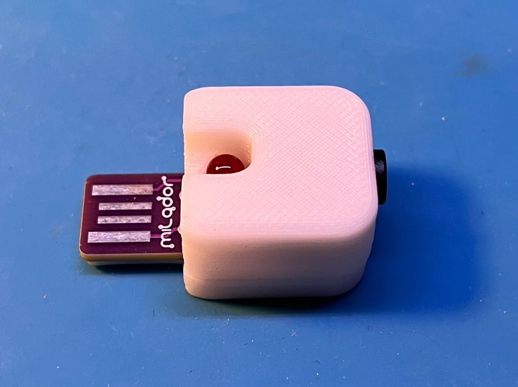 An assembled USB switch tester on a blue table.