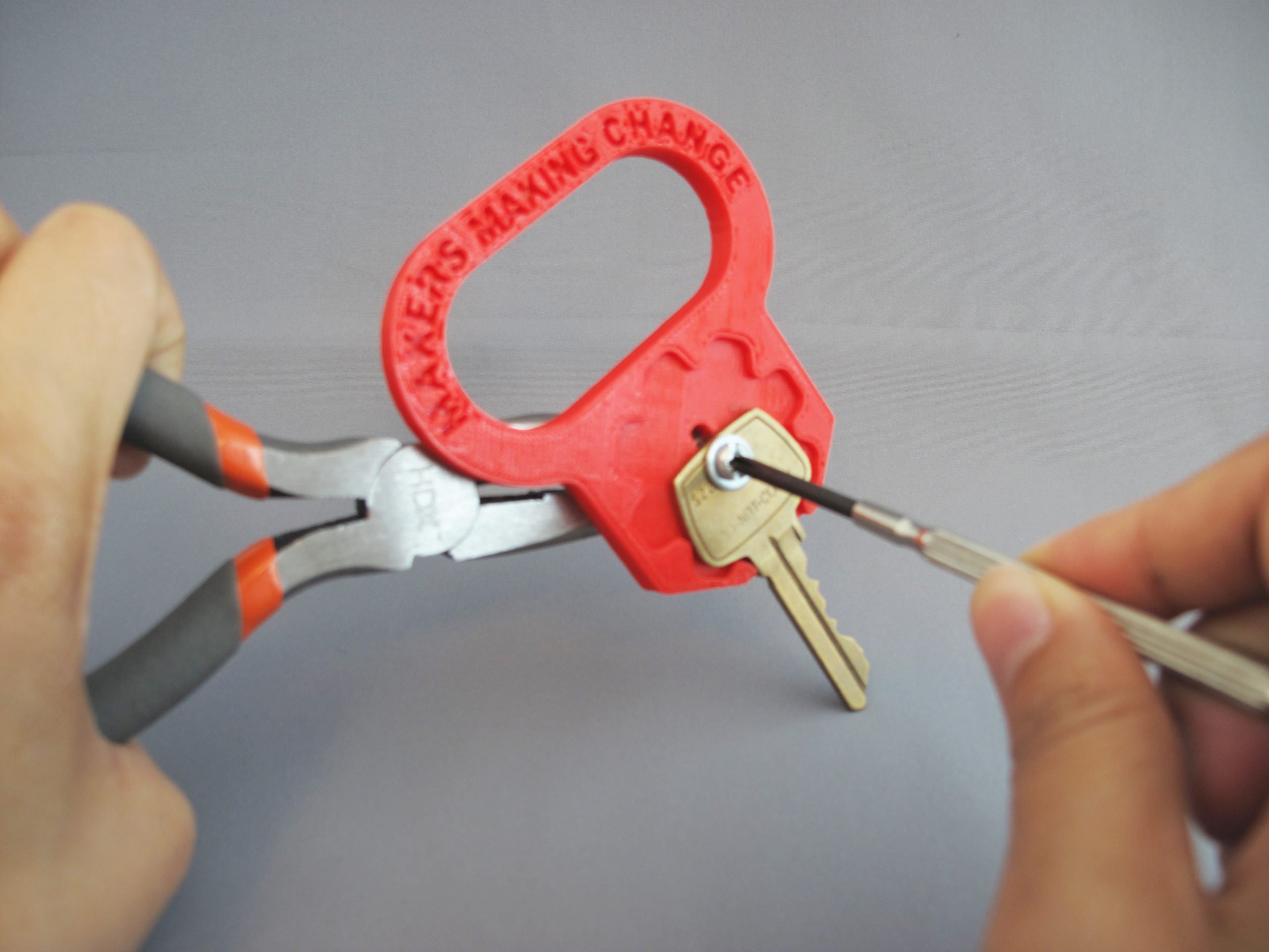 A user assembling the 3D Printed Key Turner