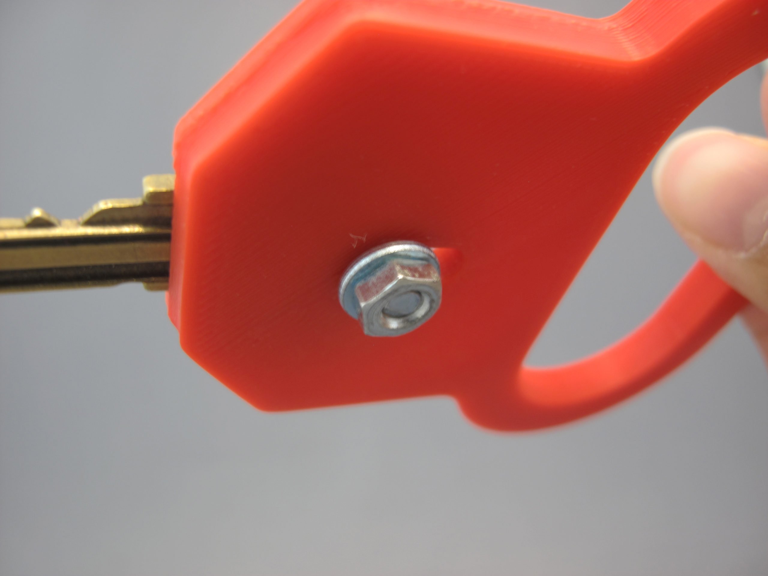 A user assembling the 3D Printed Key Turner