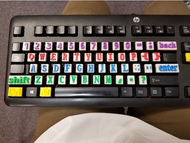 Image of a keyboard with the raised letters attached to them.