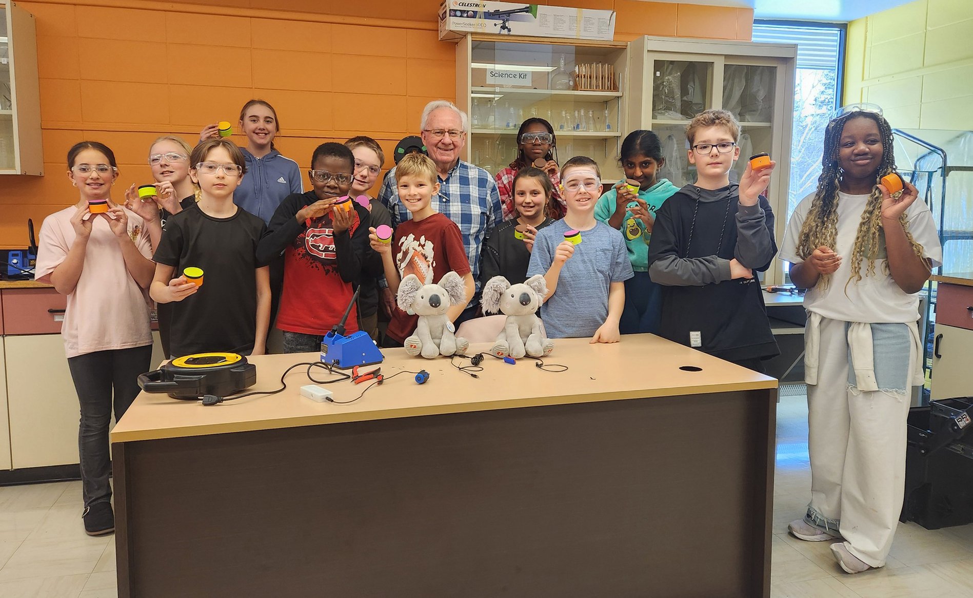 A group of students holding up 3d printed switches