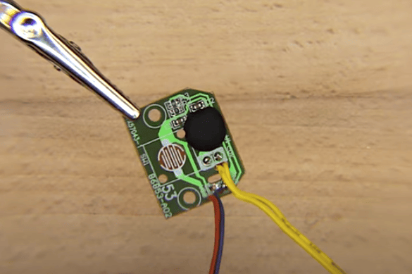 A green PCB with 4 wires soldered to it.