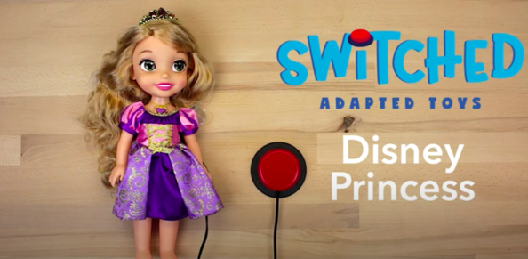 A Disney princess in a purple gown with a red assistive switch