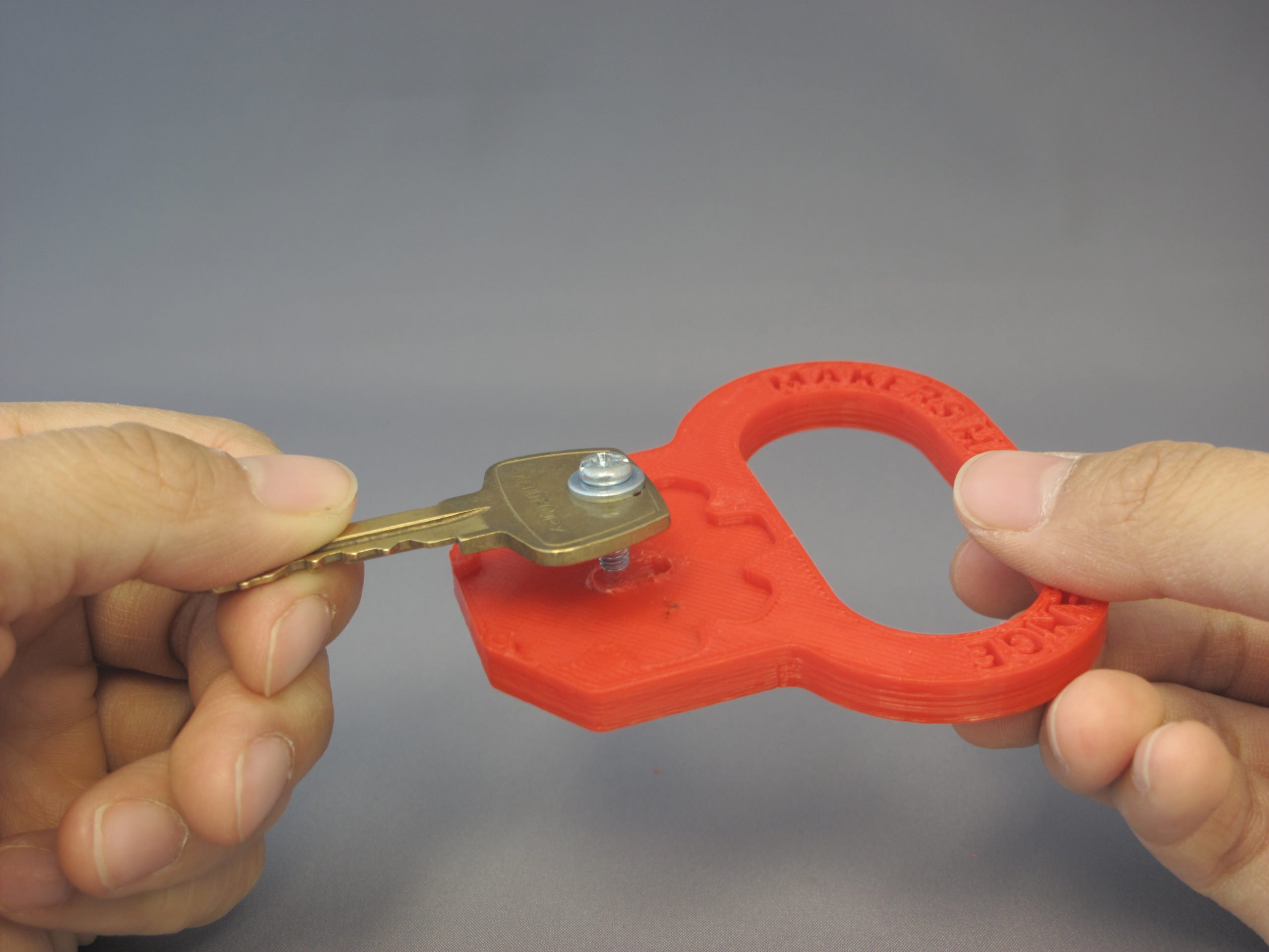 A user assembling the 3D Printed Key Turner