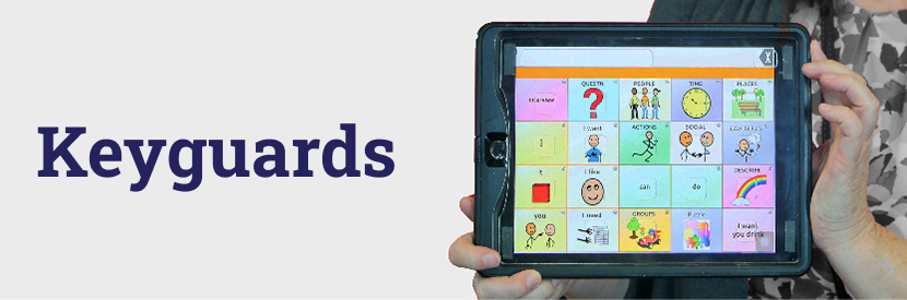 A person holding an iPad with a A-A-C app loaded. Overlayed on top is a transparent acrylic keyguard.