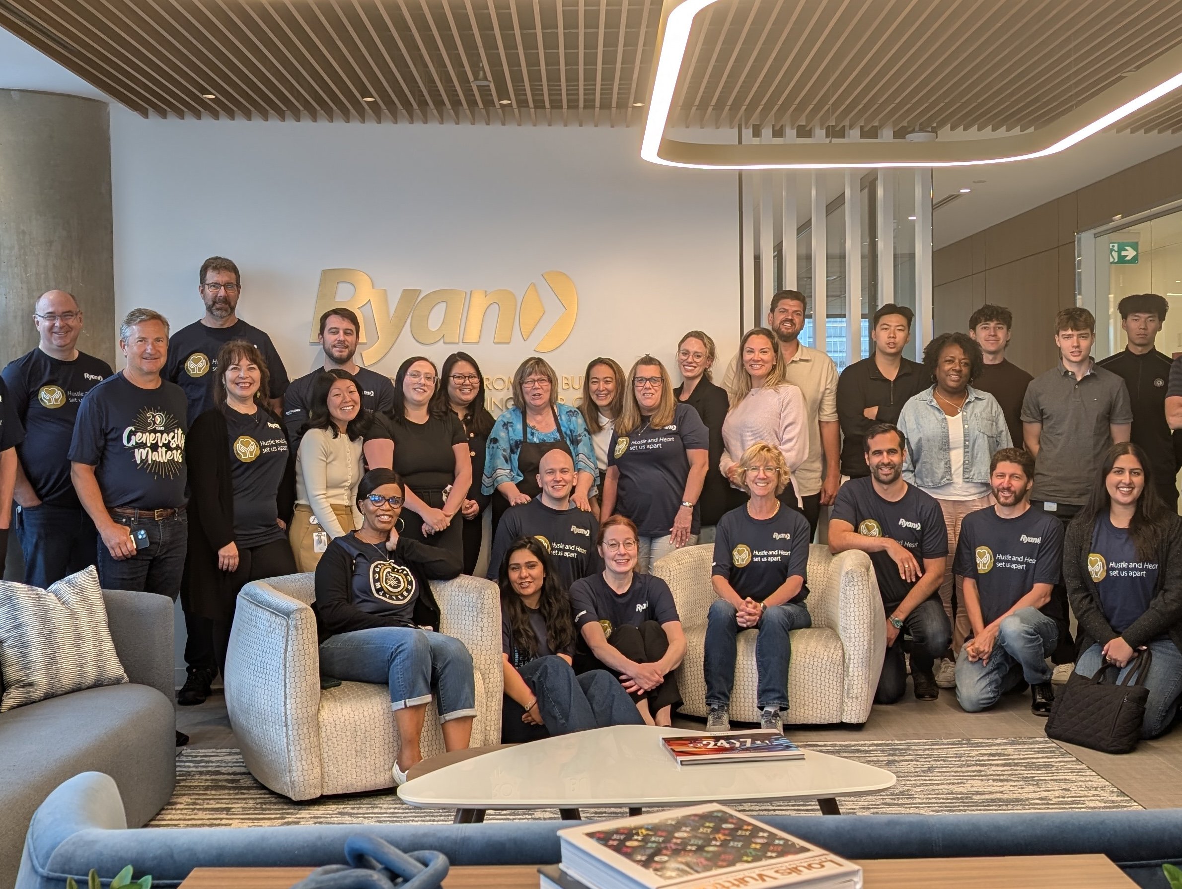 Ryan Vancouver staff stand together for a big group photo.