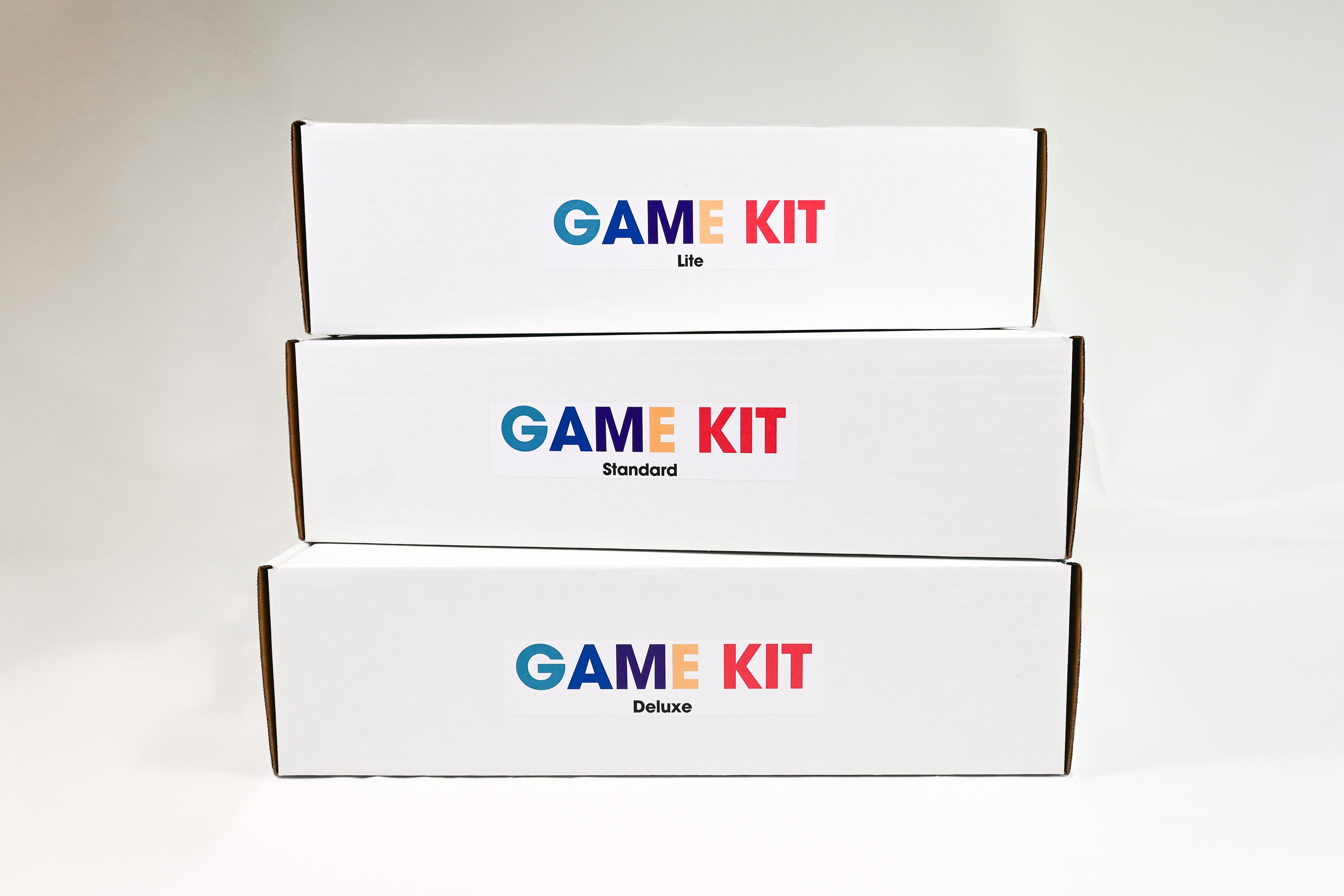 3 MMC GAME Kit boxes stacked up