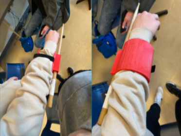 A collage of two images, both showing an arm wearing a red 3d printed drum stick holder from the top and bottom side.