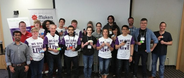 A group shot of Telus staff at an MMC build.
