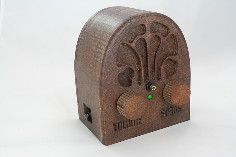 A wooden music box player.