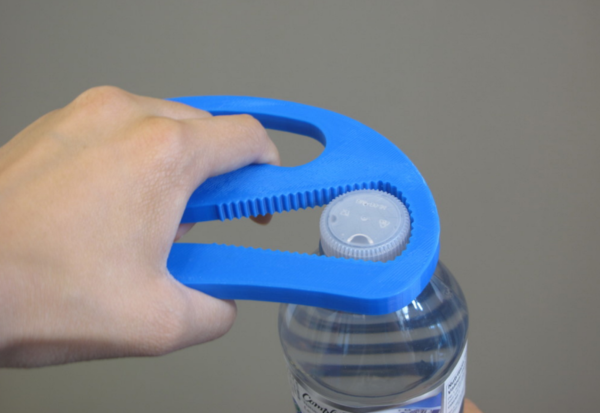 A hand gripping a blue Bottle Opener around the cap of a water bottle.