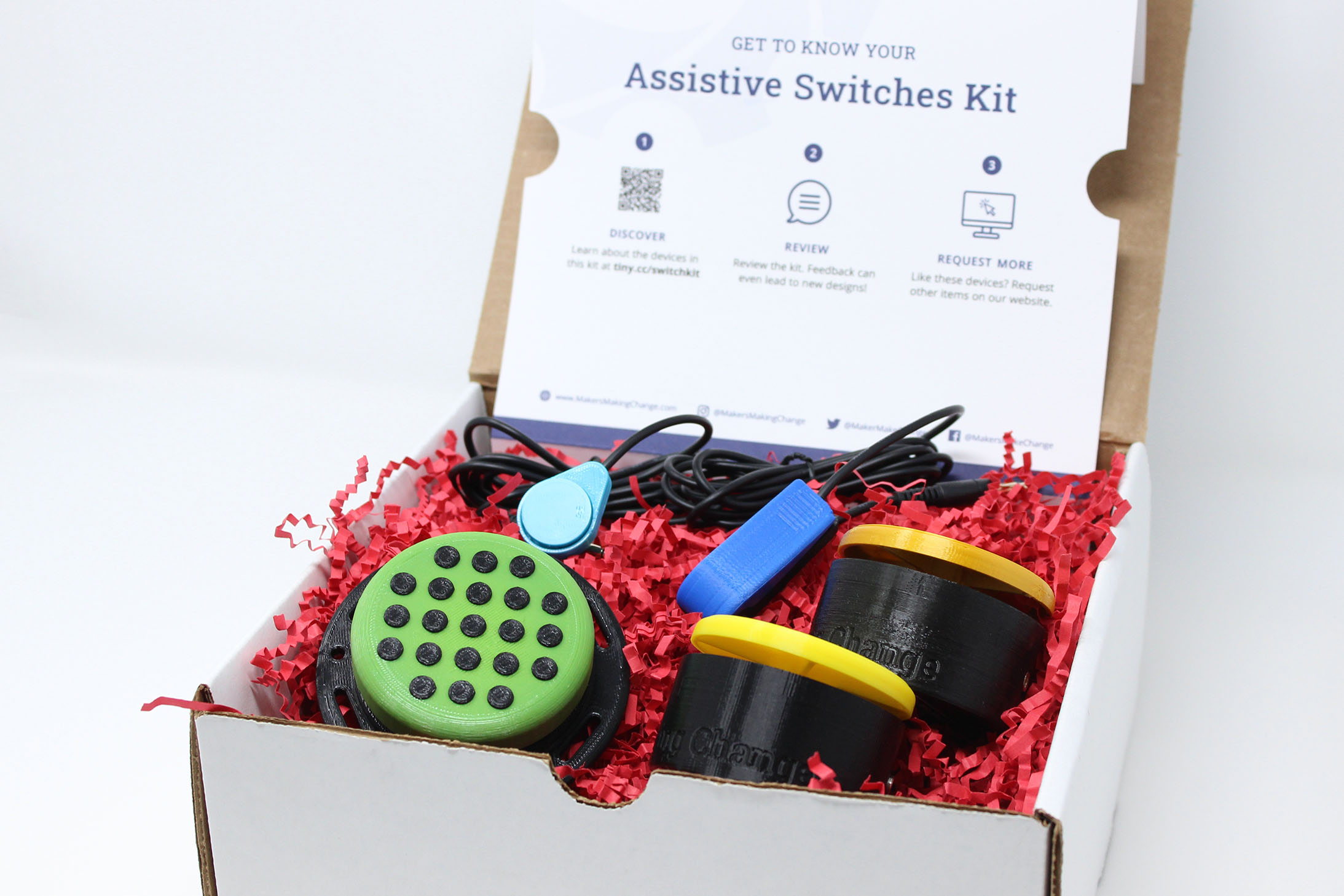 Five 3d printed accessible switches in a white box.