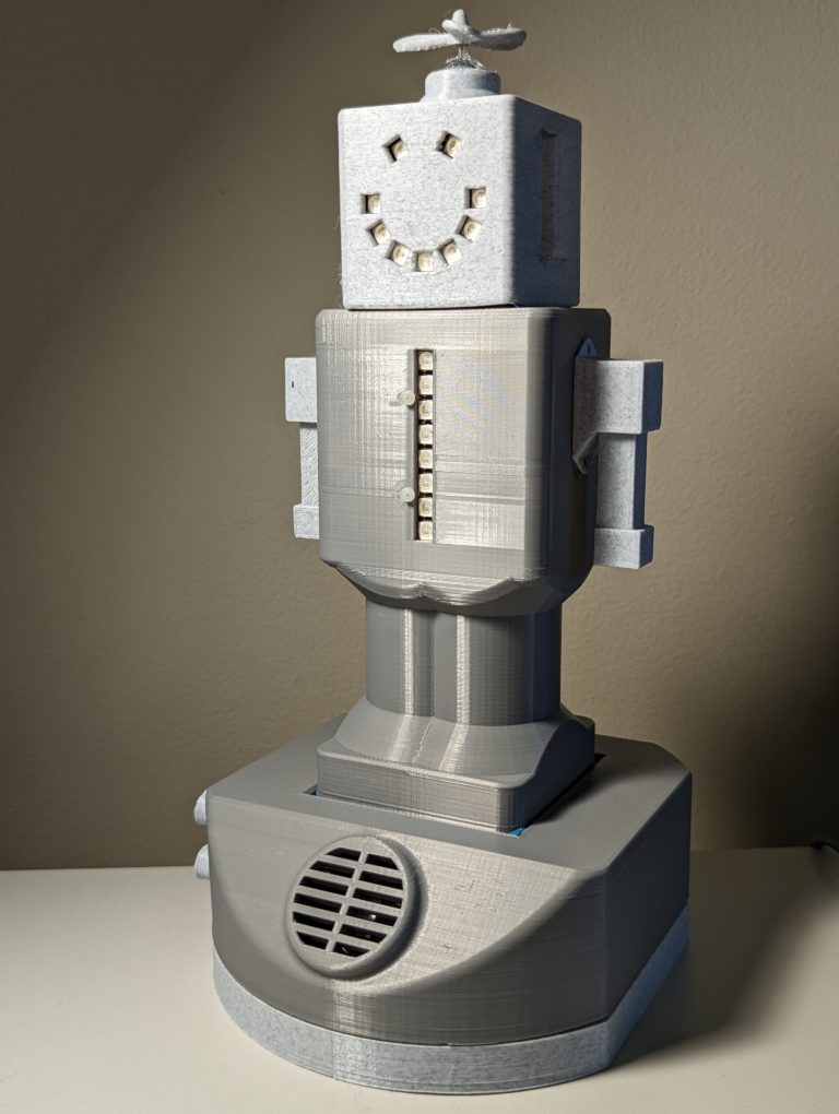 Grey robot-looking AT toy.