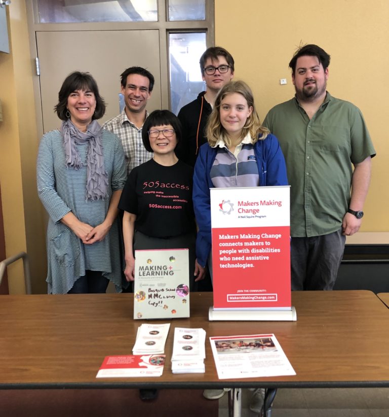 Members of the New Mexico MMC chapter standing behind an MMC poster.