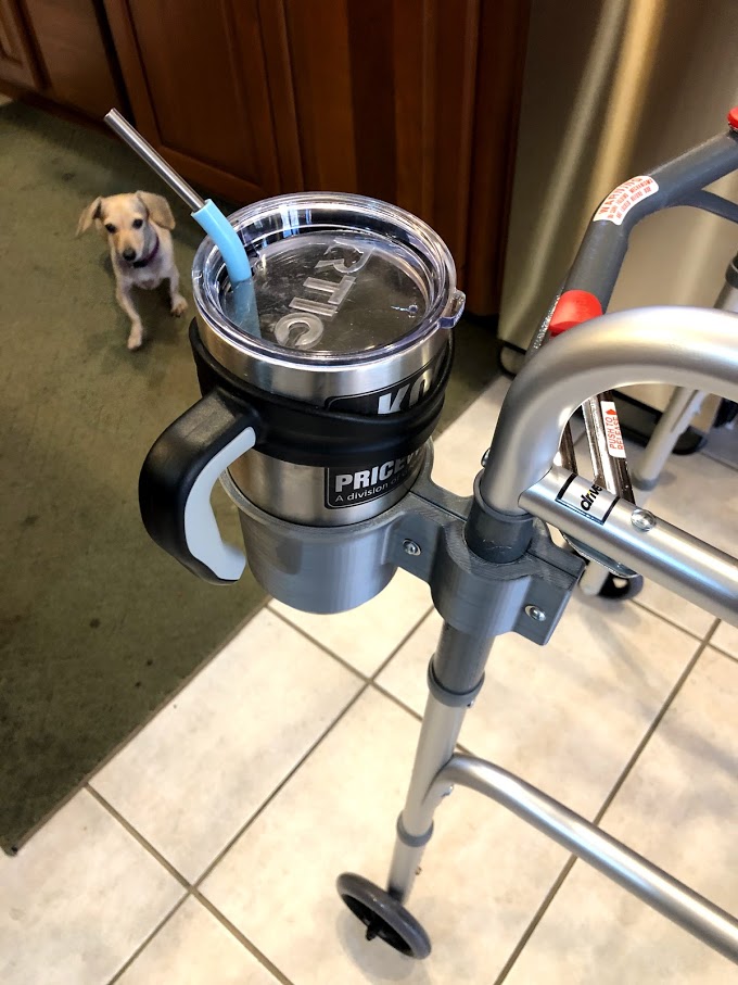 Picture of the Walker Cup Holder attached to a walker holding an insulated cup