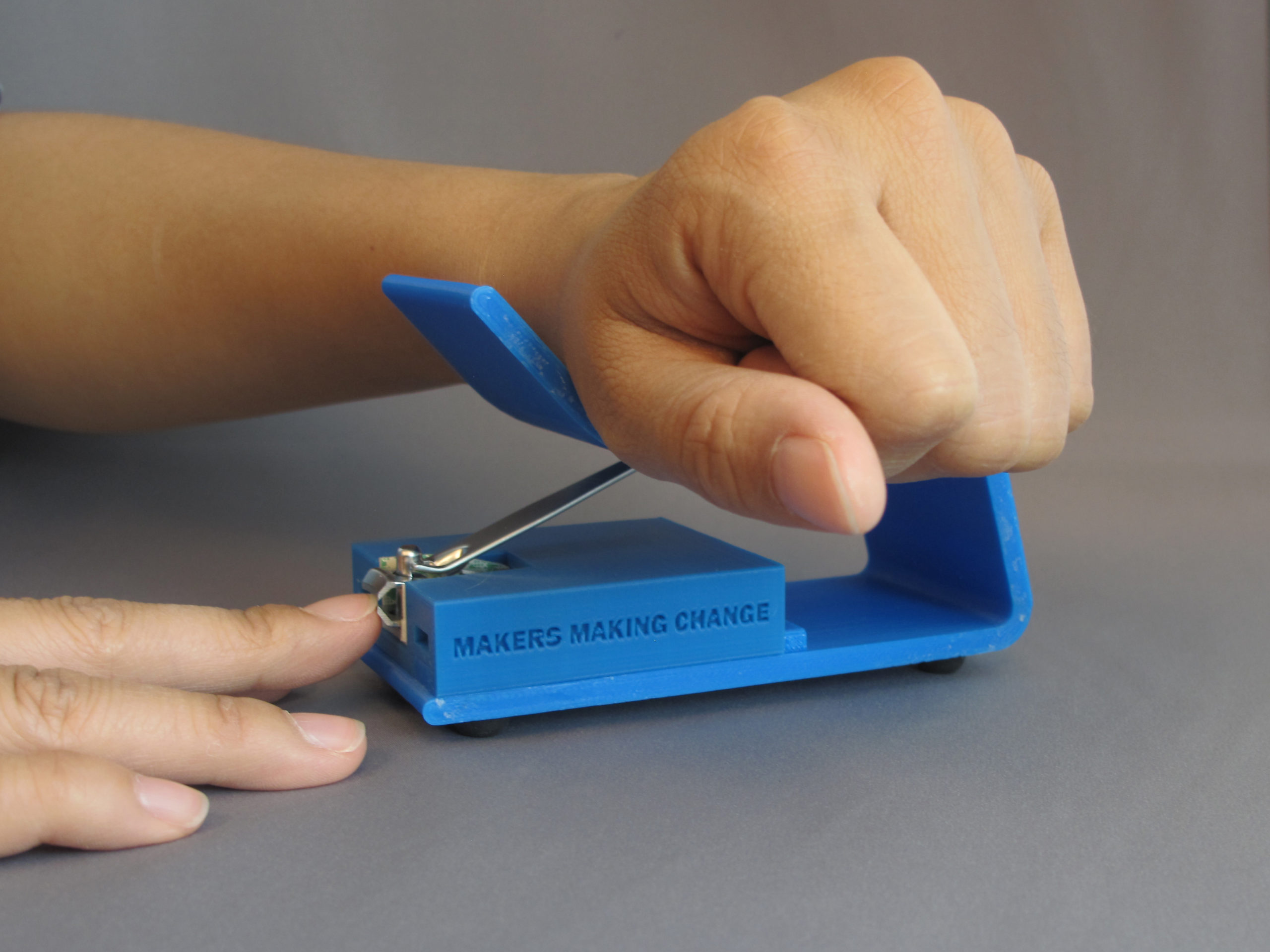 A user using the 3D Printed Nail Clipper to clip their nails with ease
