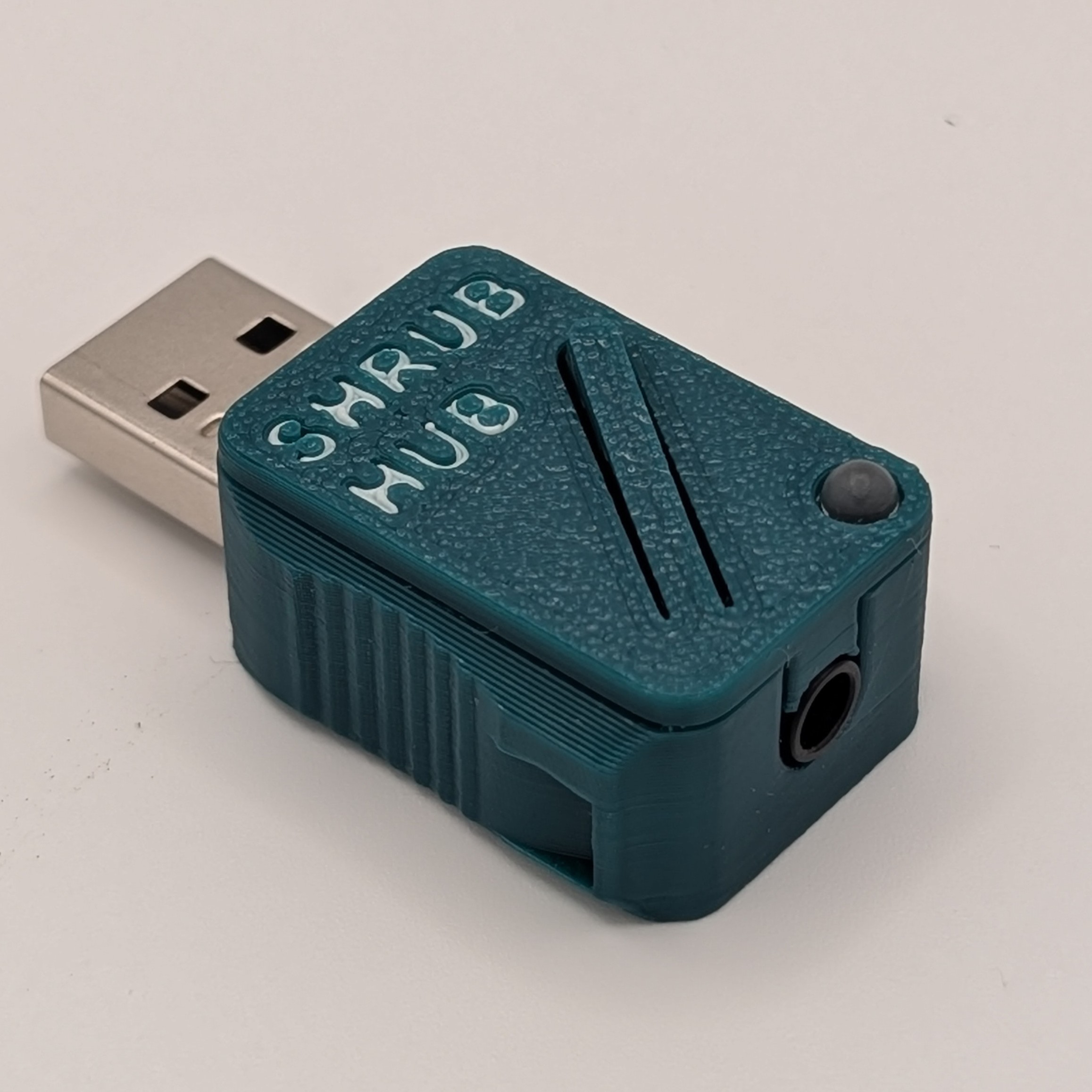 Shrub Hub printed in green on a grey background