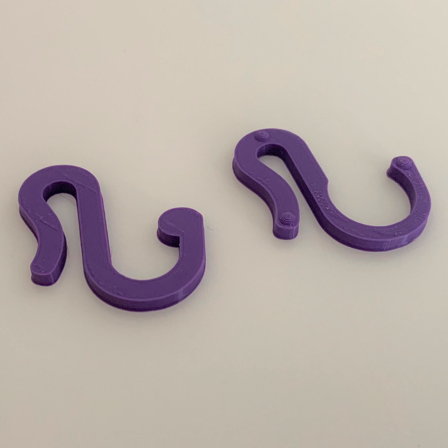 Picture of the two hooks that make up the Cane Cart Holder. The
