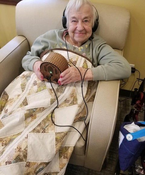 A user holding the Dementia Music Box.
