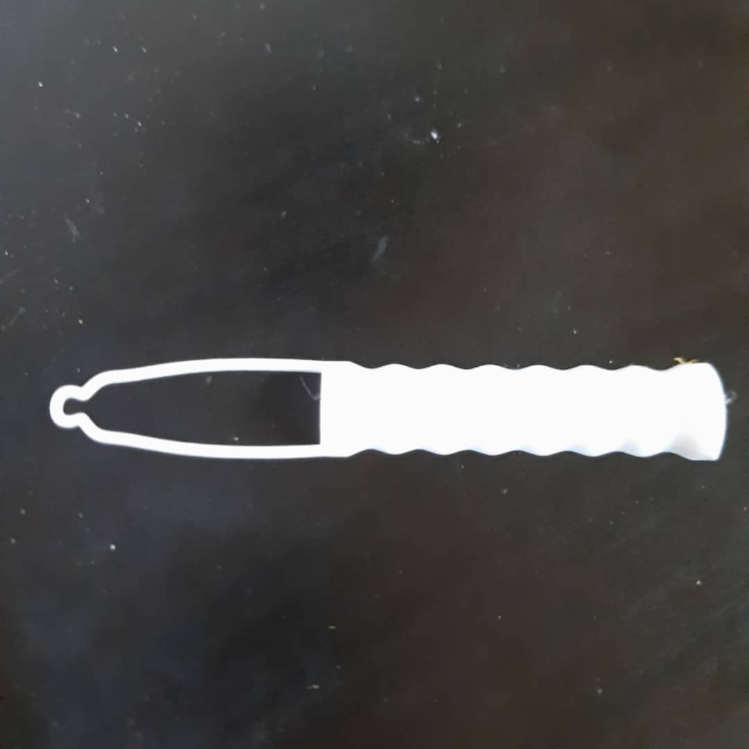 A white 3d printed button aid with a looped hook.