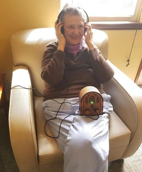A user holding the Dementia Music Box.