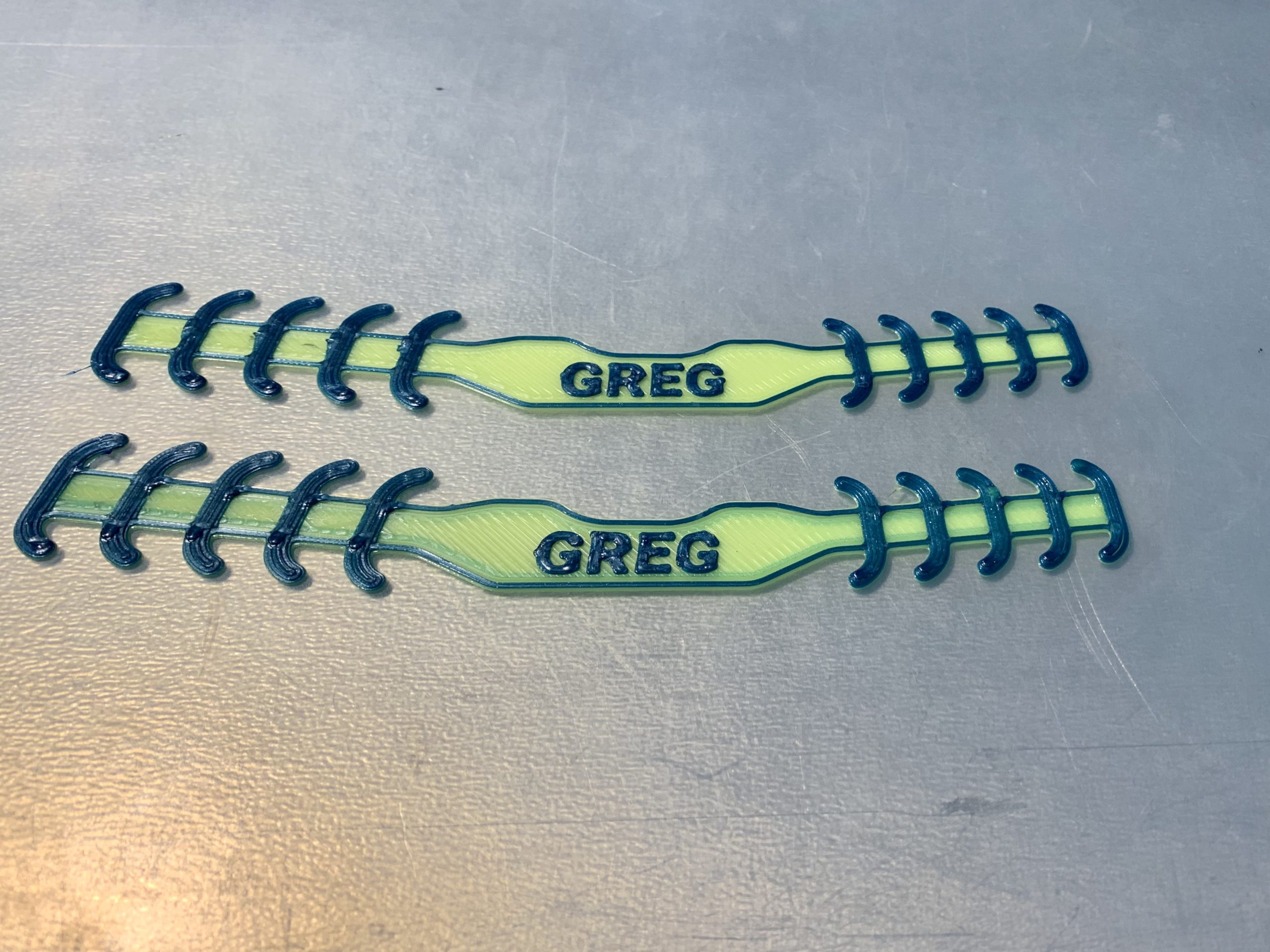 Picture of ear savers customized with the word Greg