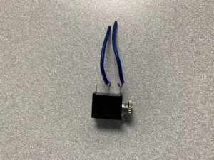 A mono jack with wires attached.