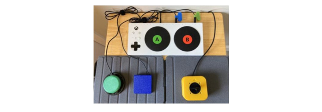 An Xbox adaptive controller with three adaptive switches.