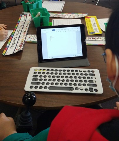 A keyboard overlay and a tablet.