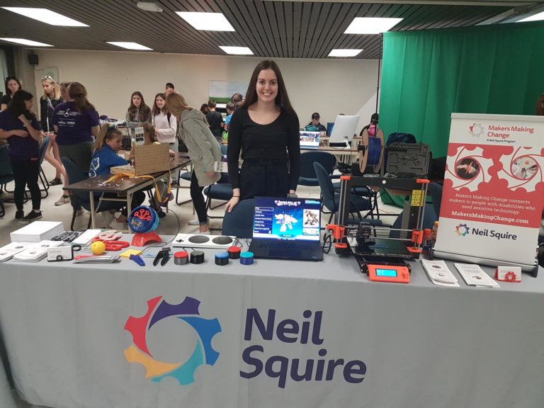 An MMC staff at a booth.