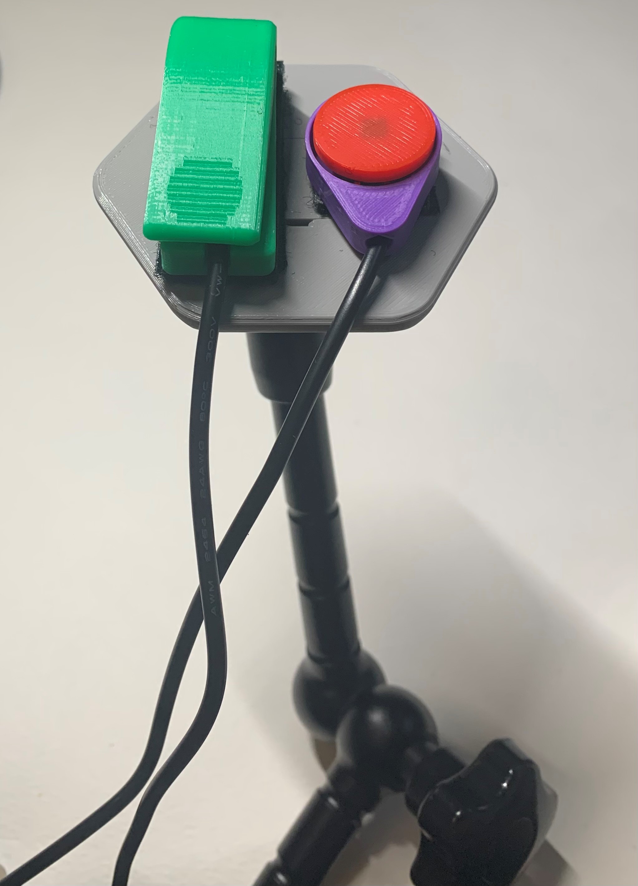 Open Universal Mount attached to a mounting arm with switches attached to the top surface using hook and loop fastener
