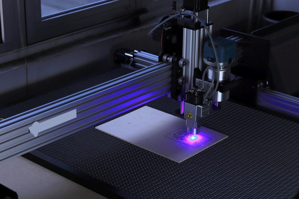 A 3d printer laser cutting.