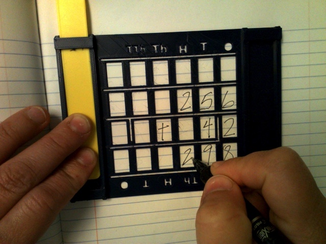 A black number aligner.