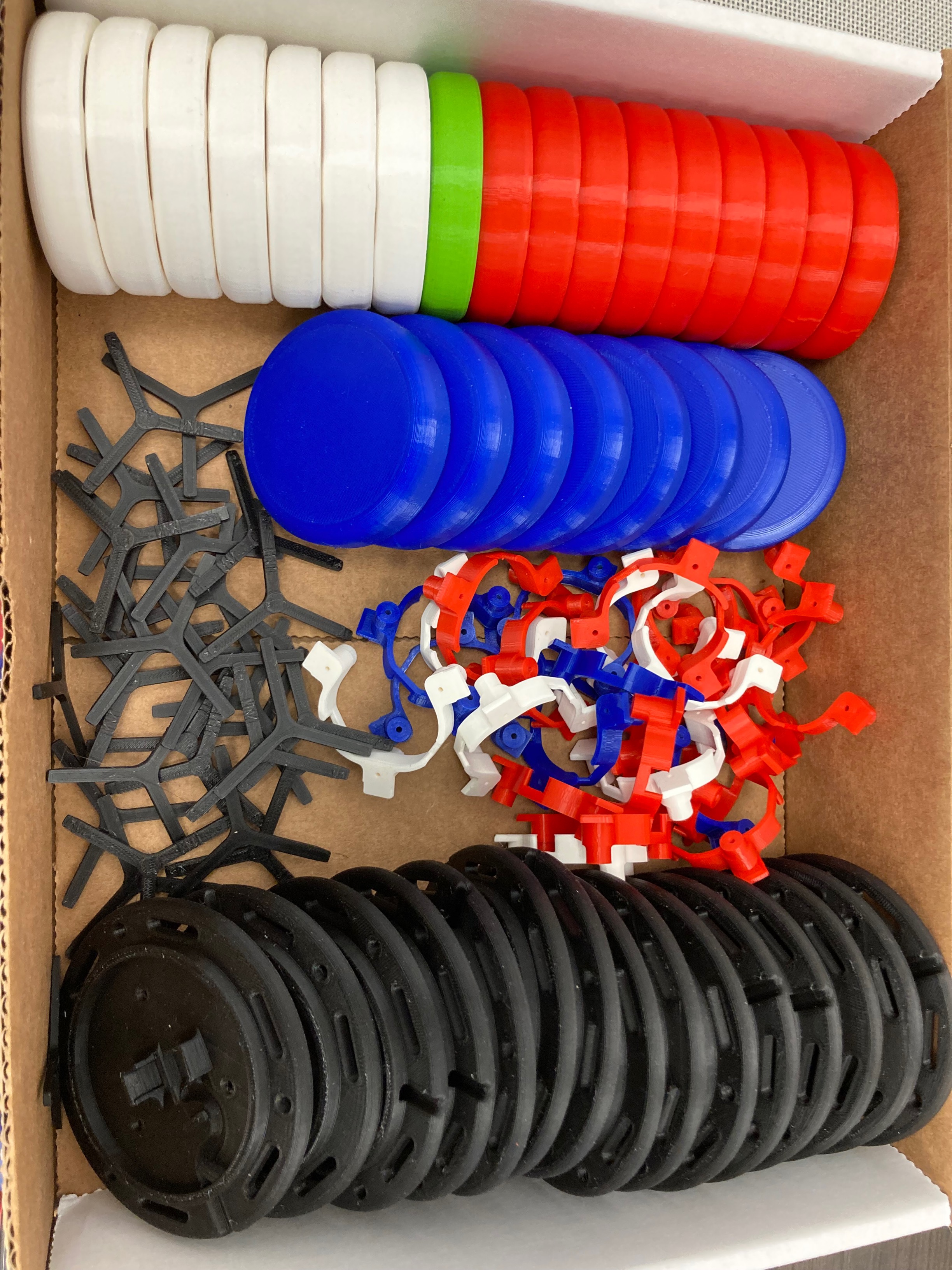 A box of 3D printed parts to build Interact Switches