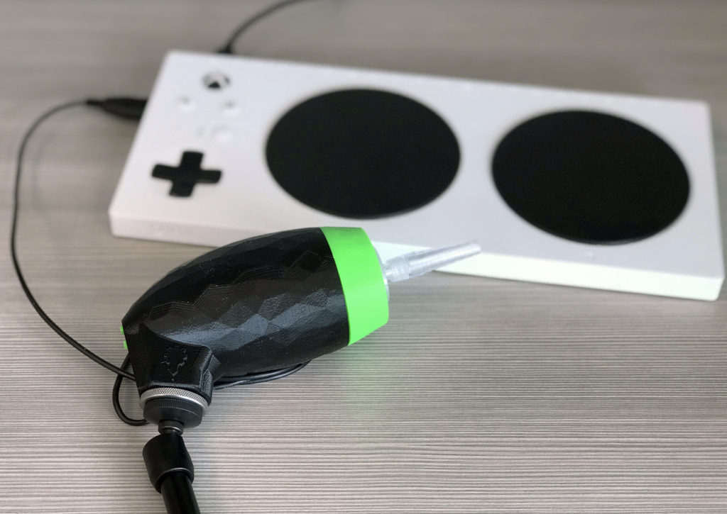 A Lip Sync attached to a gaming controller.