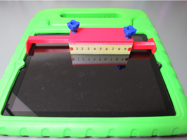 Photo of the keyguard easy measurement device on top of a tablet with a case