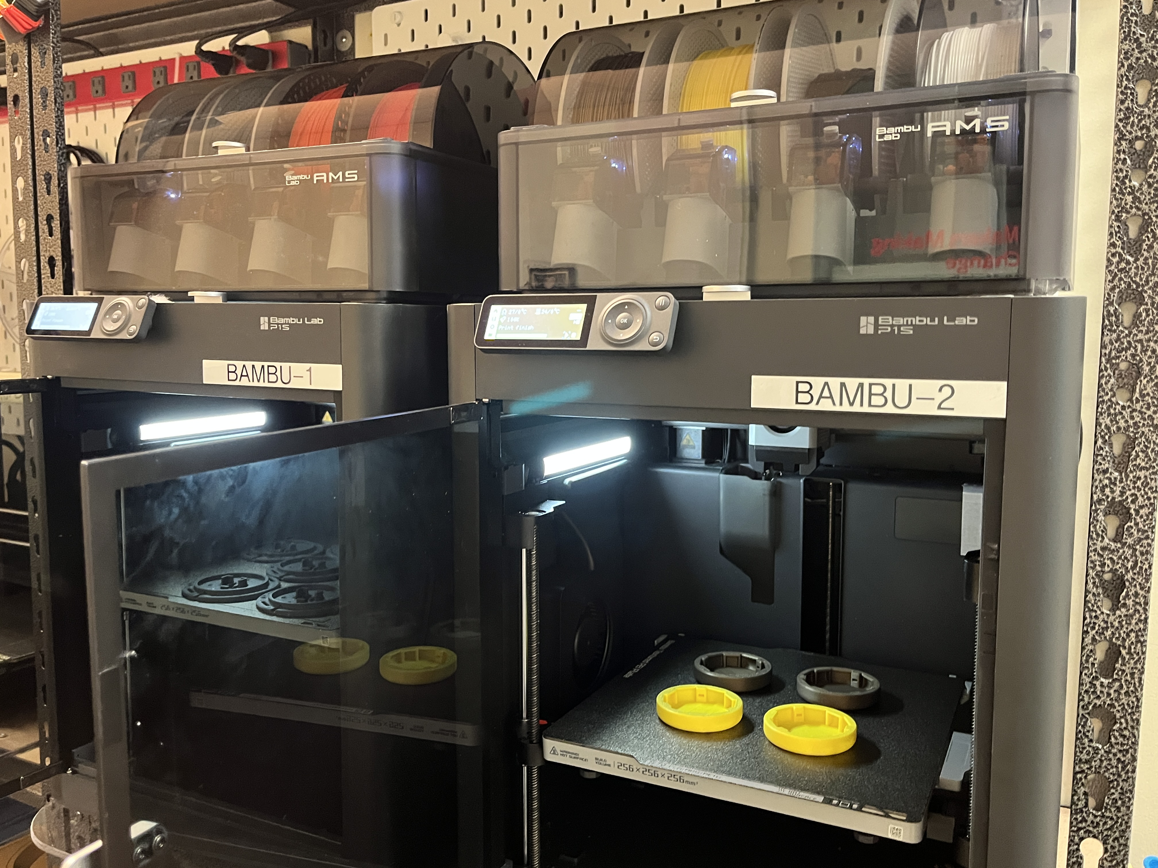 Two Bambu P1S printers with MMC devices on the print bed