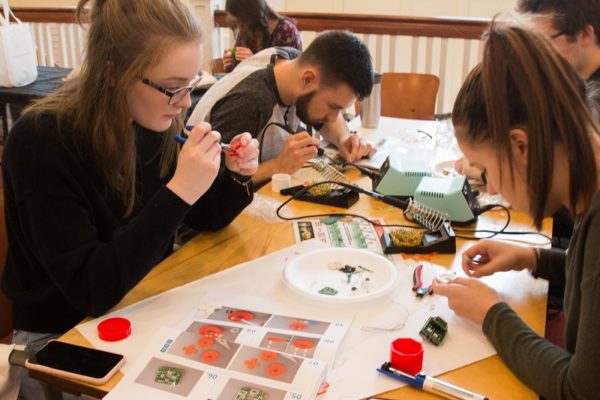 Students building assistive devices.