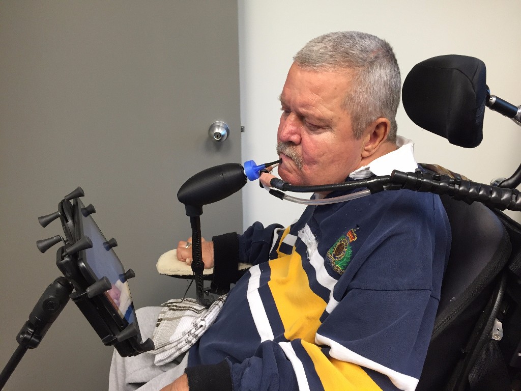 Don Danbrook, in a wheelchair, uses a very early LipSync.