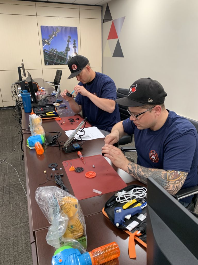 Participants soldering.