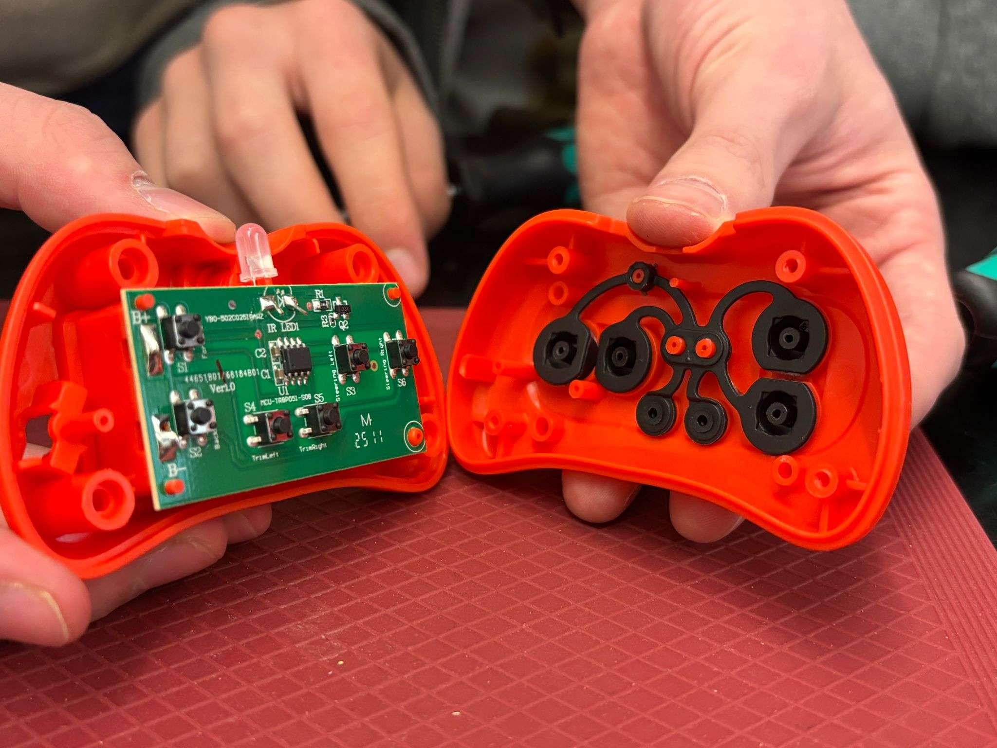 The internal working of a toy, including the circuit board.