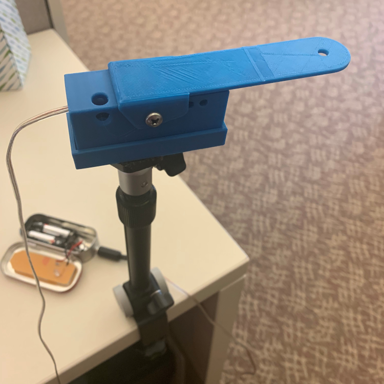 Picture of assembled lever switch, including mounting to a table. Lever has 4 inch overhang from switch body, and is about 2.5 inches wide.