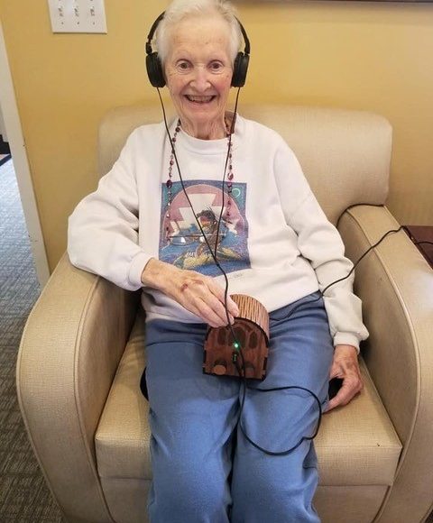 A user holding the Dementia Music Box.