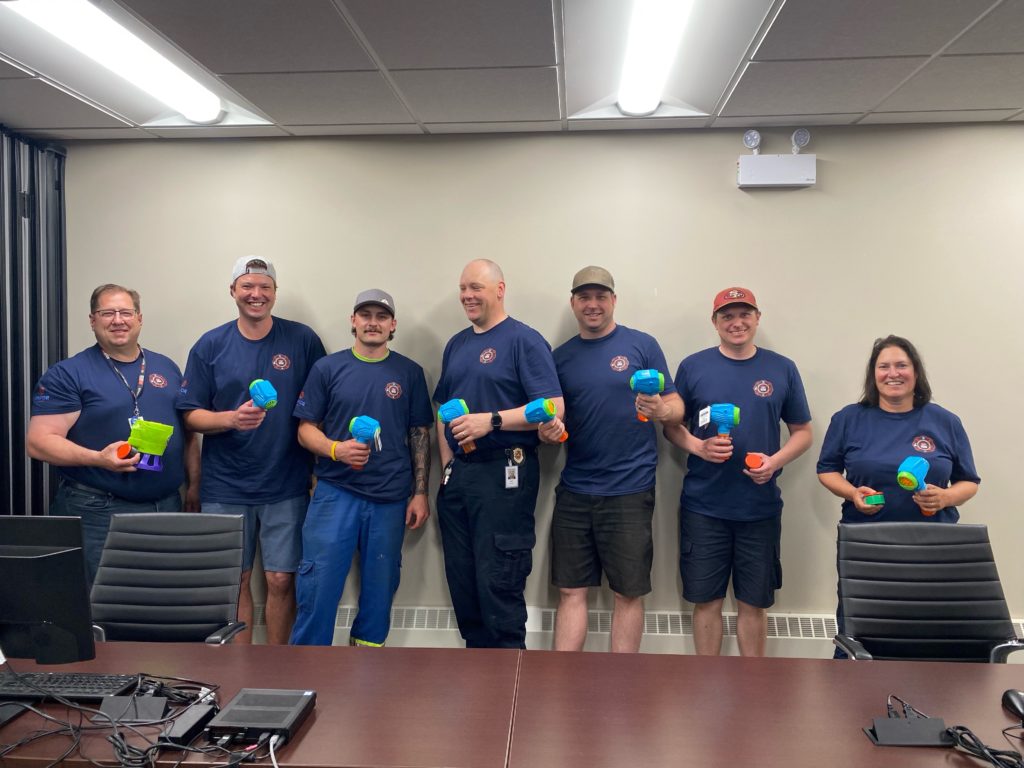 Participants holding switch-adapted bubble blowers.